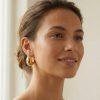 Boucles d’oreilles puces « Luna » en acier inoxydable doré, au design bombé en forme de croissant moderne