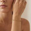Bracelet chaîne « Maya » en acier inoxydable doré avec maillons délicats et motifs trèfle ajourés